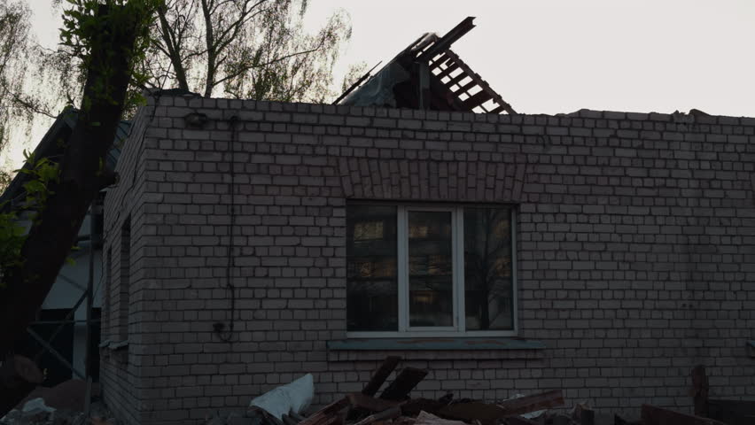 A Building That Was Damaged After a Storm Witness Roof Destruction and Debris Captured in Stunning 4K Resolution