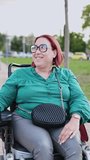 Happy disabled woman smiling in electric wheelchair in park - Powered by Shutterstock - Get 15% off with code: PIKWIZARD15