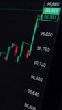 Close-up of a monitor showing a stock and crypto market candlestick chart with rising and falling prices. Investment analysis and trading concept. Vertical video - Powered by Shutterstock - Get 15% off with code: PIKWIZARD15