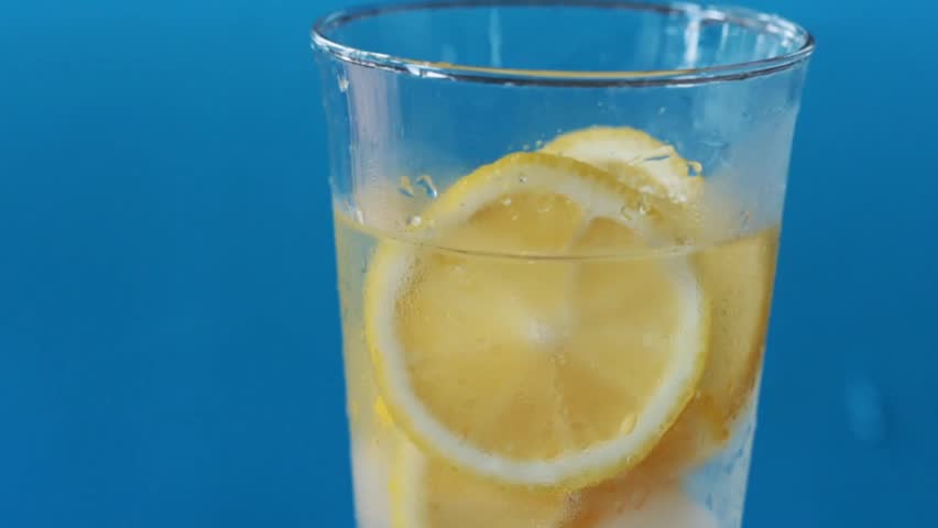 Glass of lemonade with lemon slices