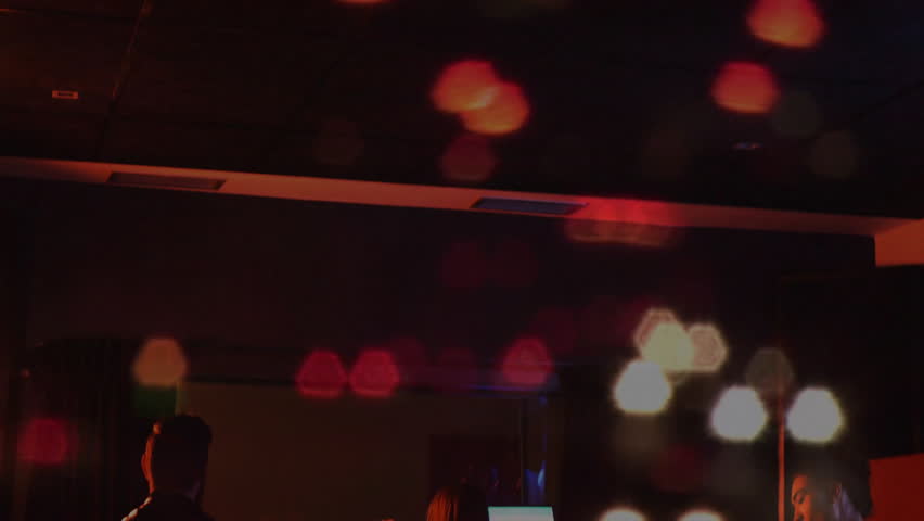 Music bandmates performing on moody stage, mixing guitars drums with animated waveform and bokeh. Musicians, concert, performance, entertainment, monochrome, ambiance, creativity