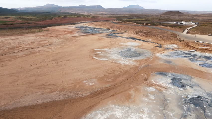 Aerial view Namafjall Geothermal Area in Iceland. Boiling Mud Pots and Smoking Fumaroles Surround the Vibrant Sulphur Crystals, Creating a Mesmerizing View of Iceland Geothermal Landscape.