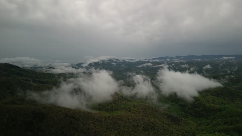 Aerial panning on low clouds in southern Appalachian Mountains in Blowing Rock North Carolina