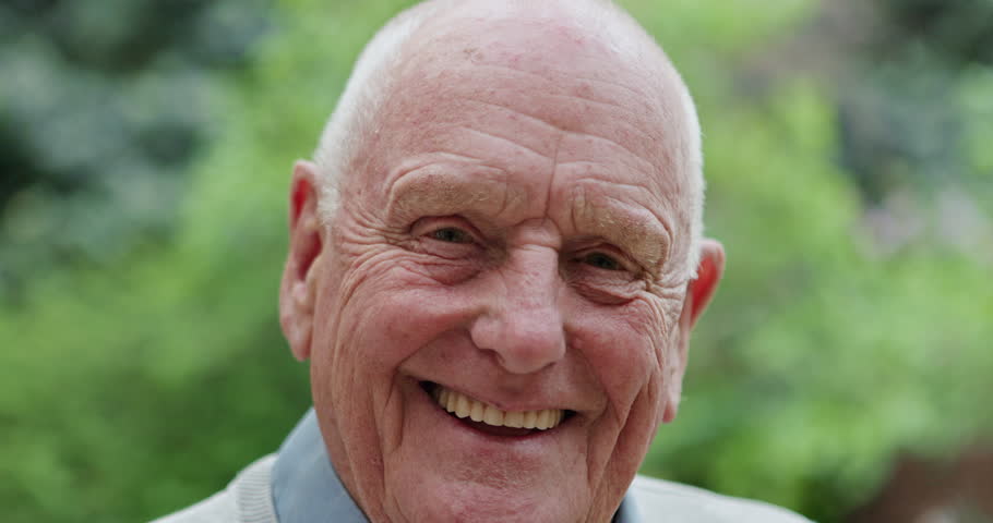 Face, outdoor and senior man with a smile, peace and Canada with happiness, nature or wellness. Portrait, pensioner or elderly person with gratitude, retirement or calm in the garden, cheerful or joy