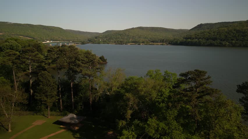 Aerial reveal past trees to Tennessee River Bridge on Interstate 24 near Chattanooga