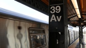 New York subway station. Metro train on metropolitan platform, United States public transportation. Elevated outdoor railway N line, Queens. NYC passenger railroad traffic, 39 avenue Long Island City - Powered by Shutterstock - Get 15% off with code: PIKWIZARD15