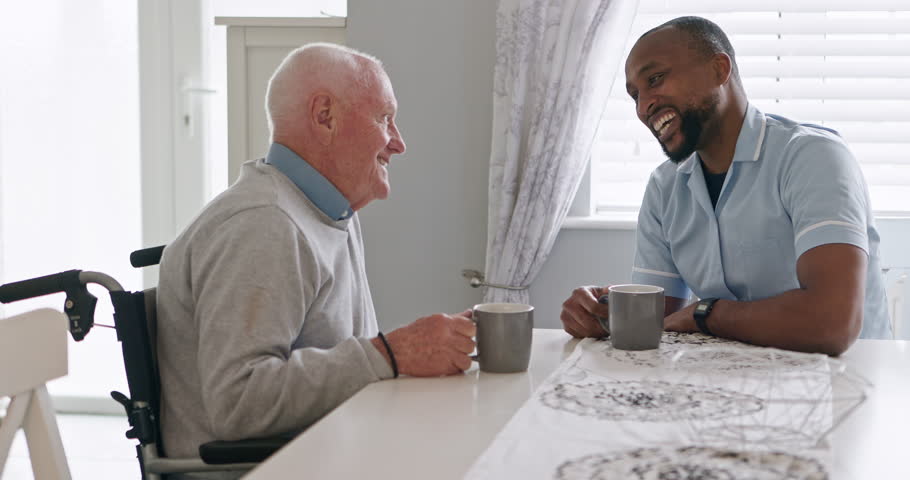 Support, nurse and old man in a wheelchair talk with volunteer, care or trust retirement healthcare. Elderly, caregiver or empathy for person with a disability or help with kindness or coffee break
