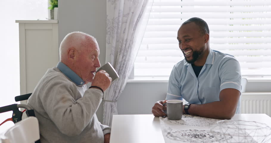 Support, nurse and old man in a wheelchair talk with volunteer, care or trust retirement healthcare. Elderly, caregiver or empathy for person with a disability or help with kindness or coffee break