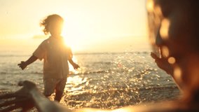 A heartwarming moment as a child runs joyfully into their mother's arms by the sea at sunset. Pure love, trust, and connection captured in golden light and gentle ocean waves. - Powered by Shutterstock - Get 15% off with code: PIKWIZARD15