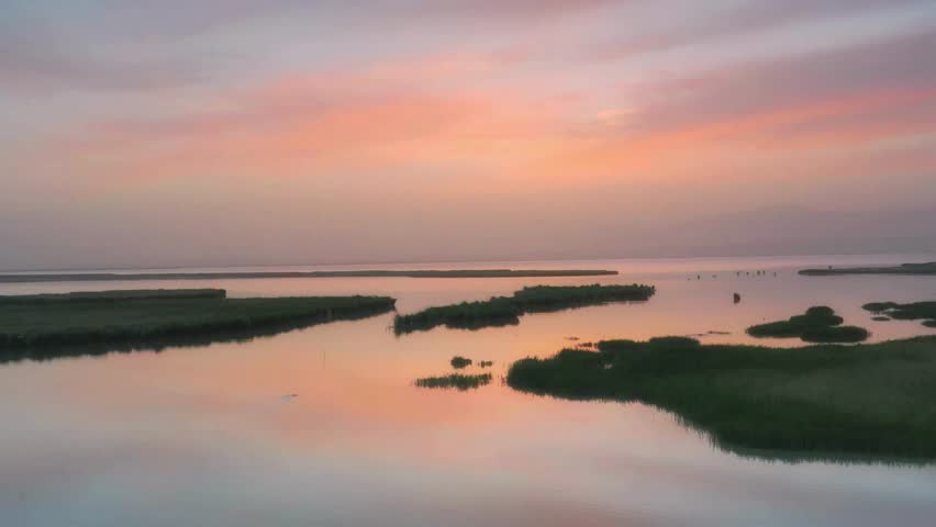 Serene Sunset over Coastal Marsh Estuary Landscape