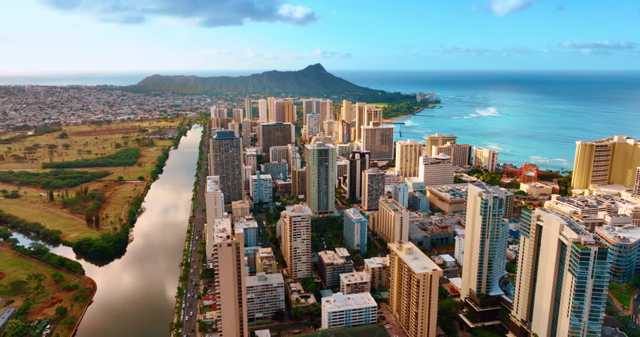 Modern high-rise downtown of Honolulu, Hawaii, USA. Diamond Head Crater at backdrop. Aerial view.