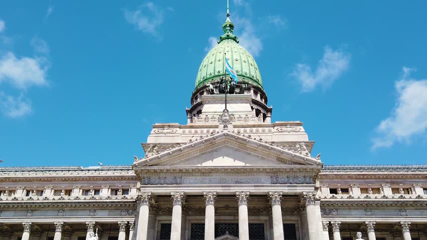 Establishing Argentine Congress building, national flag over blue daylight skyline, National emblem of Buenos Aires city