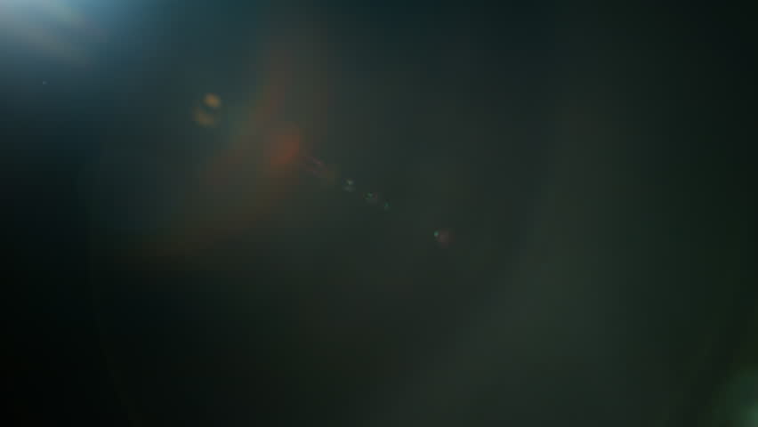Real Cinematic Lens Flare Overlay on Black Background at 1000fps Slow Motion.