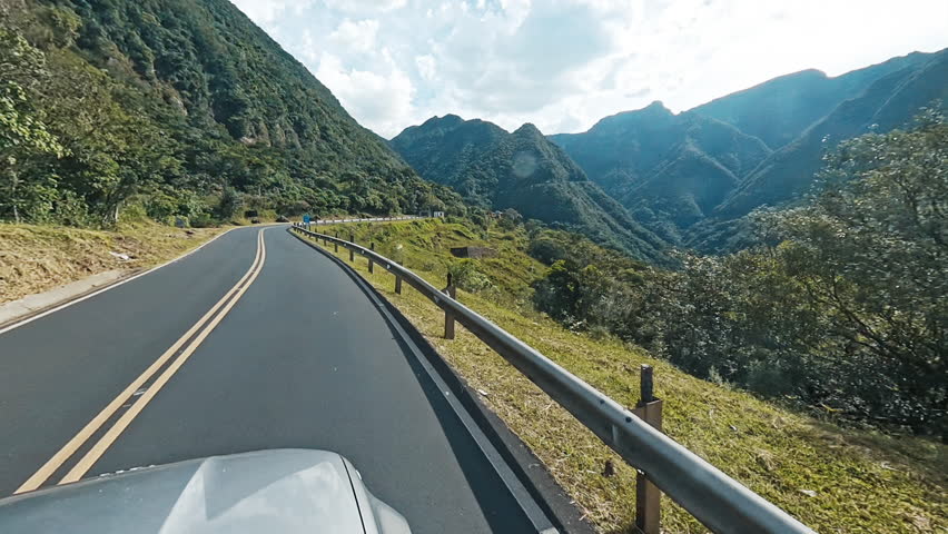 Car moves on the road in the mountains