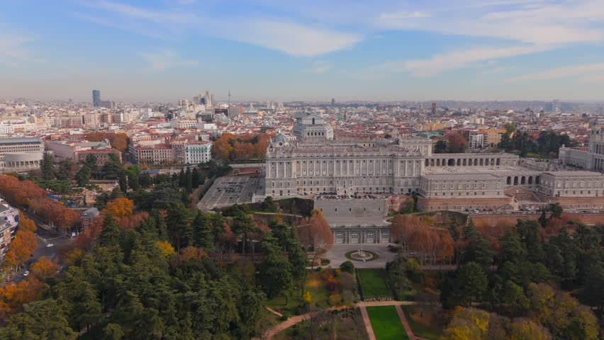 Enjoy stunning aerial views of Madrids Royal Palace and Almudena Cathedral, showcasing their remarkable architecture and beautiful landscape that draw countless visitors globally