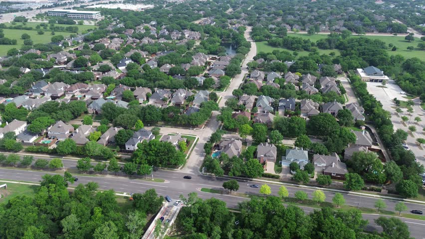 Busy traffic along West Plano Parkway, Dallas North Tollway, lakeside mansion homes, solar panel roof, modern pools in upscale suburban area green space near Steeplechase Park and Balcones Drive. USA