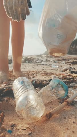 Individuals dedicate their time to cleaning up a beach, removing plastic waste and debris from the shore. Their actions highlight the importance of environmental stewardship in the community.