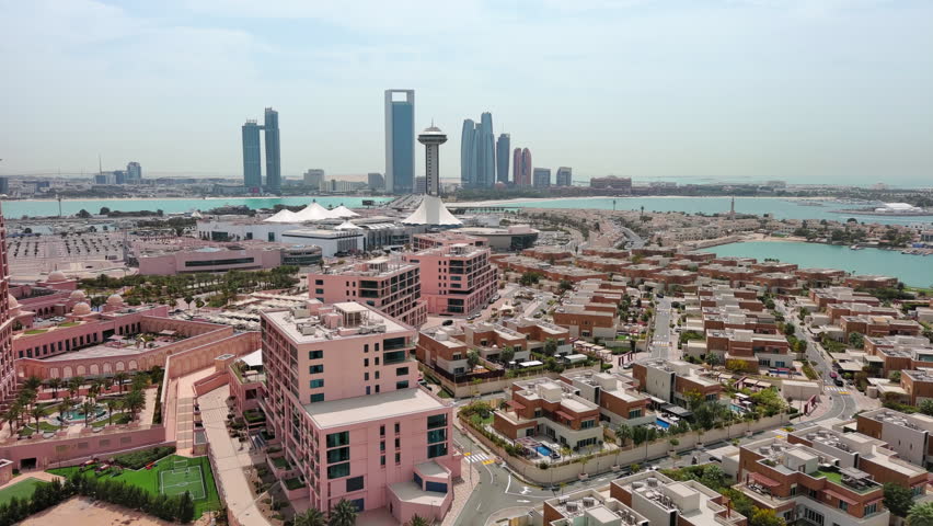 Abu Dhabi, United Arab Emirates: Aerial view of capital city of UAE, modern city skyline, financial district with skyscrapers - landscape panorama of Arabian Peninsula from above