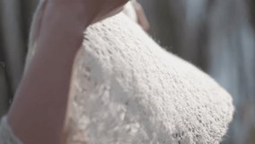 Hands holding a white cashmere shawl as a delicate scarf in bright natural light. - Powered by Shutterstock - Get 15% off with code: PIKWIZARD15