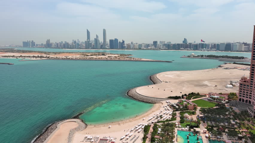 Abu Dhabi, United Arab Emirates: Aerial view of capital city of UAE, modern city skyline, financial district with skyscrapers - landscape panorama of Arabian Peninsula from above