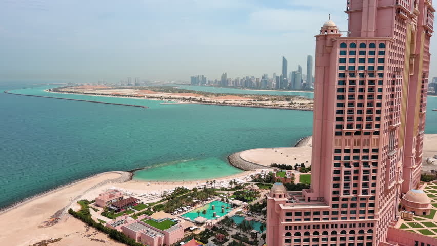 Abu Dhabi, United Arab Emirates: Aerial view of capital city of UAE, modern city skyline, financial district with skyscrapers - landscape panorama of Arabian Peninsula from above