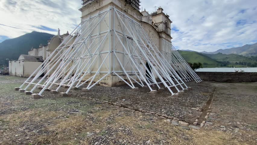 Church of the Immaculate Conception with mountains behind in Yanque, Colca Canyon, Peru.