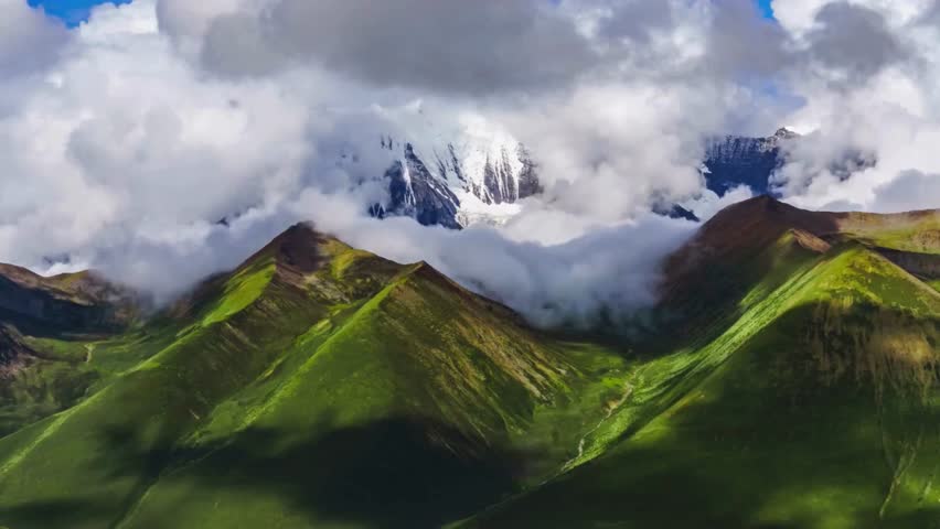 Majestic Mountain Range Enveloped in Cloudscape