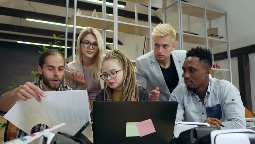 Young man and woman office colleagues which working together over business strategy in meeting room