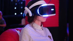 Girl wearing VR Glasses. Surprised teenager having fun play VR headset, virtual reality goggle, 3D cyber space. Futuristic neon blue red UV lighting. Digital technology, metaverse game, entertainment
 - Powered by Shutterstock - Get 15% off with code: PIKWIZARD15