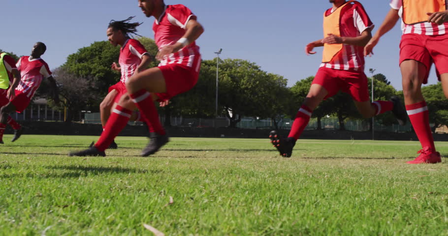 Soccer players sprinting on grass field, showcasing AR code overlay for sports technology insights. Athletics, teamwork, innovation, sportwear, outdoor, high-energy, competition