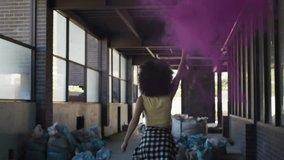 female artist holding smoke canister walking industrial corridor, with animated tech word cloud. Abstract, graffiti, urban, artistic, vibrant, futuristic, experimental - Powered by Shutterstock - Get 15% off with code: PIKWIZARD15