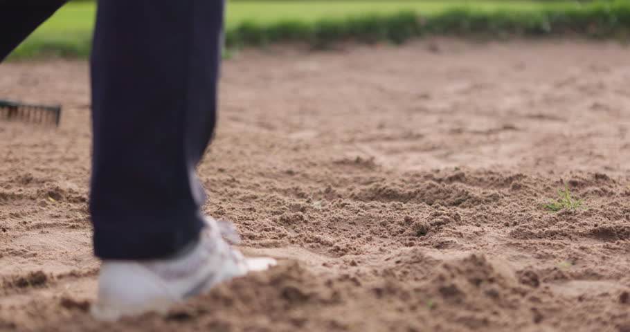 Man, sand trap and swing on golf course in sport, game and exercise outdoor on dirt in summer. Golfer, shoes and training to develop sports stroke, hit or club ball onto grass, pitch or lawn