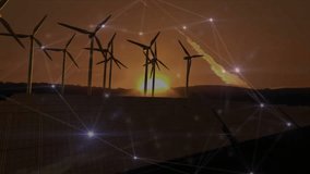 Wind turbines rising above solar panels glowing network nodes connecting orange sunset sky. Sustainability, green energy, technology, futurism, landscape, environment, connection - Powered by Shutterstock - Get 15% off with code: PIKWIZARD15