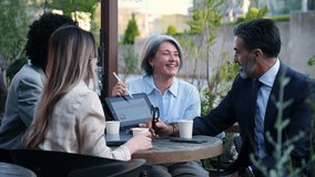 Business people discussing strategy during a meeting at a coffee shop - Powered by Shutterstock - Get 15% off with code: PIKWIZARD15