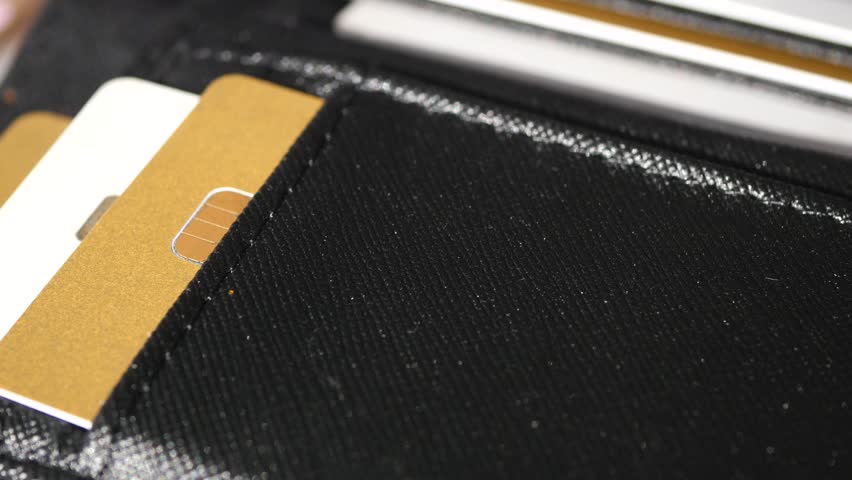 Wallet with multiple cards revealed in close-up shot