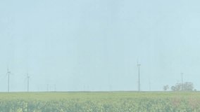 Wind turbines generating data visualization blending field scene, showing flat design bar charts. Sustainability, renewable, technology, agriculture, landscape, analytics, eco-friendly - Powered by Shutterstock - Get 15% off with code: PIKWIZARD15
