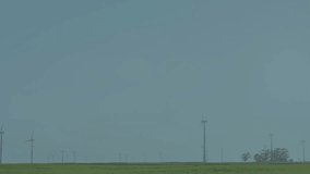 Financial stock chart overlaying rural landscape featuring candlesticks line graphs wind turbines. Technology, sustainability, finance, environment, innovation, horizon, growth - Powered by Shutterstock - Get 15% off with code: PIKWIZARD15