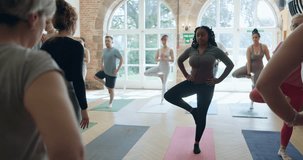 Yoga, wellness and health with black woman in class for learning, fitness and mindfulness. Balance, meditation and peace with person and tree pose in pilates studio for coaching, energy and spiritual - Powered by Shutterstock - Get 15% off with code: PIKWIZARD15