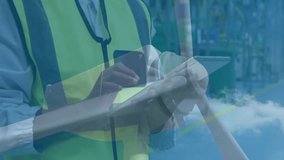 Warehouse worker wearing safety vest holding smartphone and tablet, displaying financial graphs. Industrial, logistics, technology, analytics, construction, operational, corporate - Powered by Shutterstock - Get 15% off with code: PIKWIZARD15