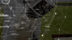 Male beekeeper lifting hive frame in grassy apiary, displaying technology nodes, bar-chart overlay. Agriculture, innovation, research, outdoor, modern, sustainability, data visualization - Powered by Shutterstock - Get 15% off with code: PIKWIZARD15