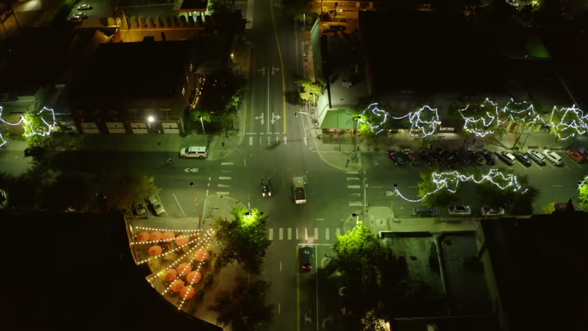 Aerial Tilt Up Shot Of String Lights On Trees In Residential Town Against Clear Sky At Night - Moscow, Idaho