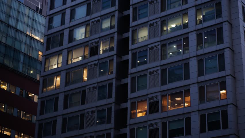 Office And Apartment Windows Glow At Dusk In Gangnam, Seoul. South Korea. low angle, panning shot
