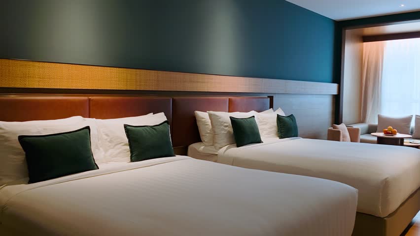 Hotel Room With Two Queen Size Beds. - wide shot