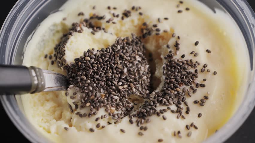 Protein yogurt with chia seeds close up, dairy product texture. Healthy and low calorie snack. High quality 4k footage