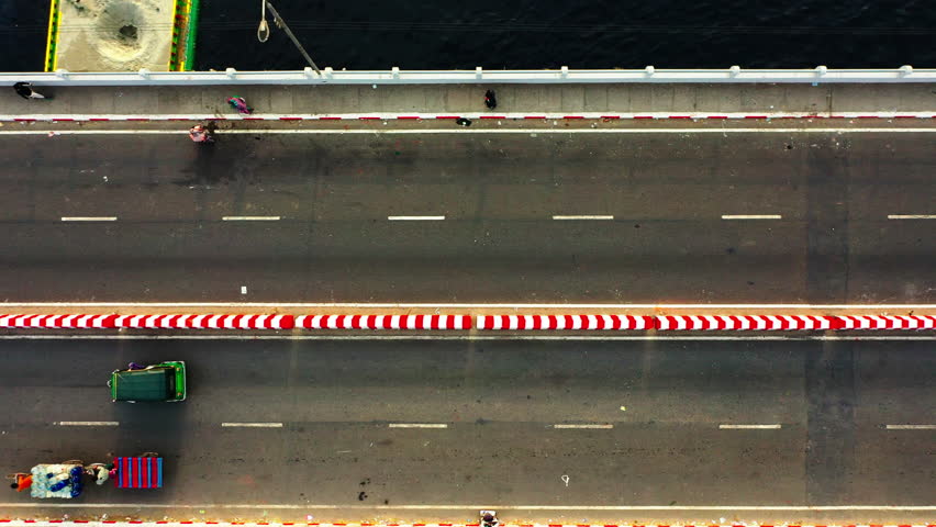 Aerial Top Upward Shot Of Vehicles Moving And People Walking On Bridge Over Buriganga River - Dhaka, Bangladesh
