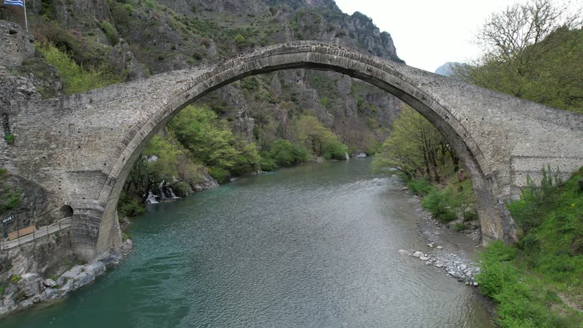 The great arched stone bridge of Plaka on Arachthos river, Tzoumerka, Greece
