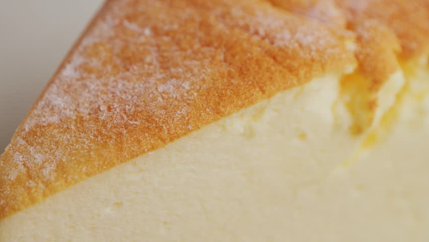 Close up of Japanese fluffy cotton cheesecake on plate. Texture of cheesecake. High quality 4k footage