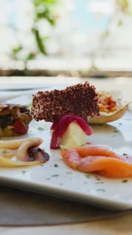 Waiter Serving The Appetizer Dish To The Beach Resort Guest 