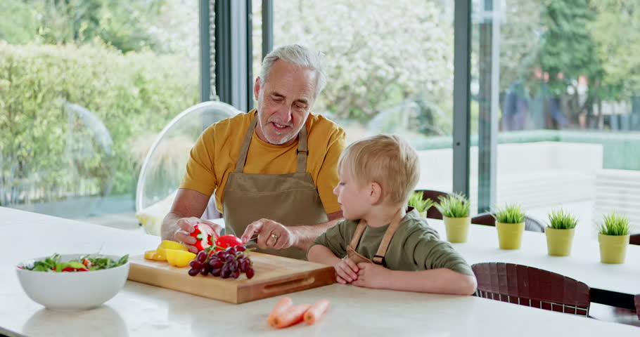 Child cooking with grandparents, healthy food and vegetables in kitchen with learning and quality time together. Family, elderly man and woman with young boy, prepare meal and nutrition at home
