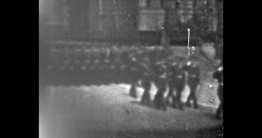 Marching soldiers on parade, old CRT TV screen. USSR celebration of victory in World War II. Archival video, film, 1970s.